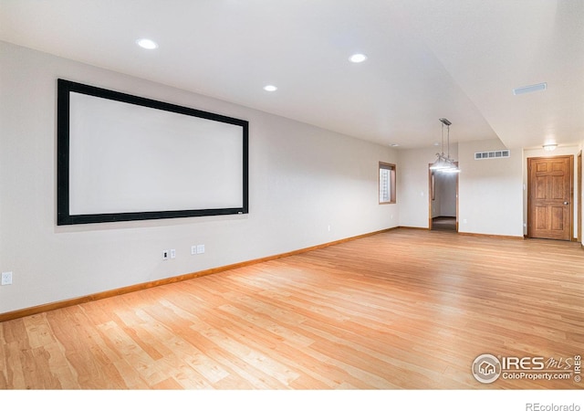 cinema featuring light wood-type flooring