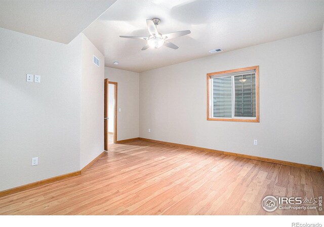 unfurnished room with ceiling fan and light hardwood / wood-style flooring