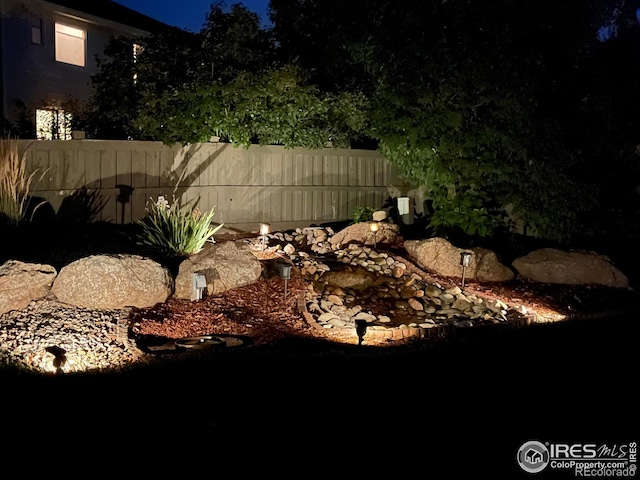 view of yard at night