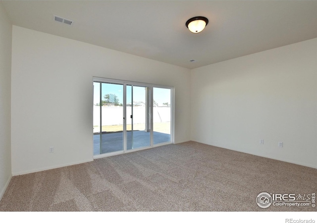empty room featuring carpet flooring