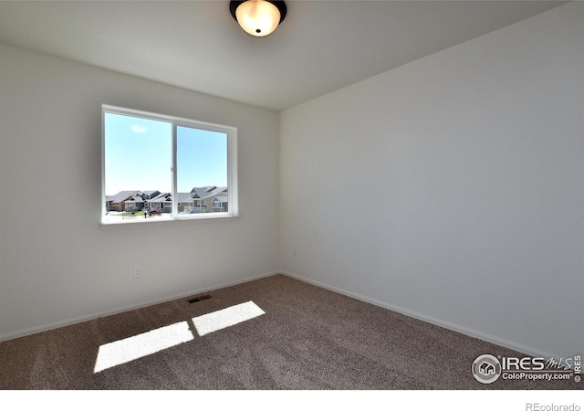 empty room featuring carpet flooring