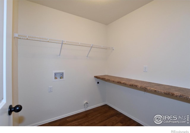 washroom featuring electric dryer hookup, hookup for a washing machine, and dark wood-type flooring