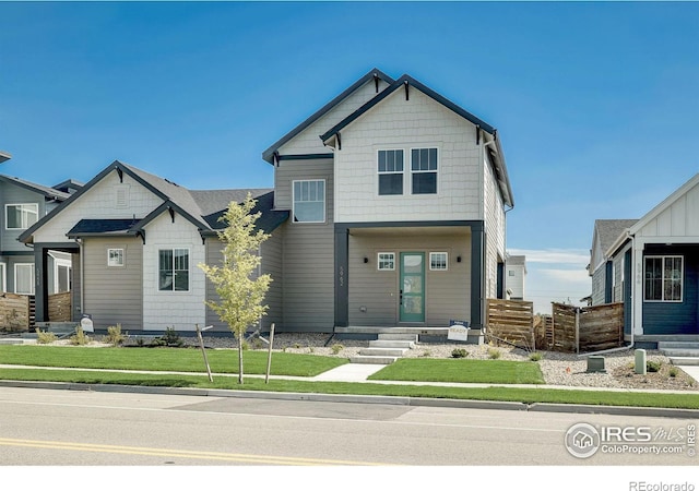 craftsman-style house with a front yard