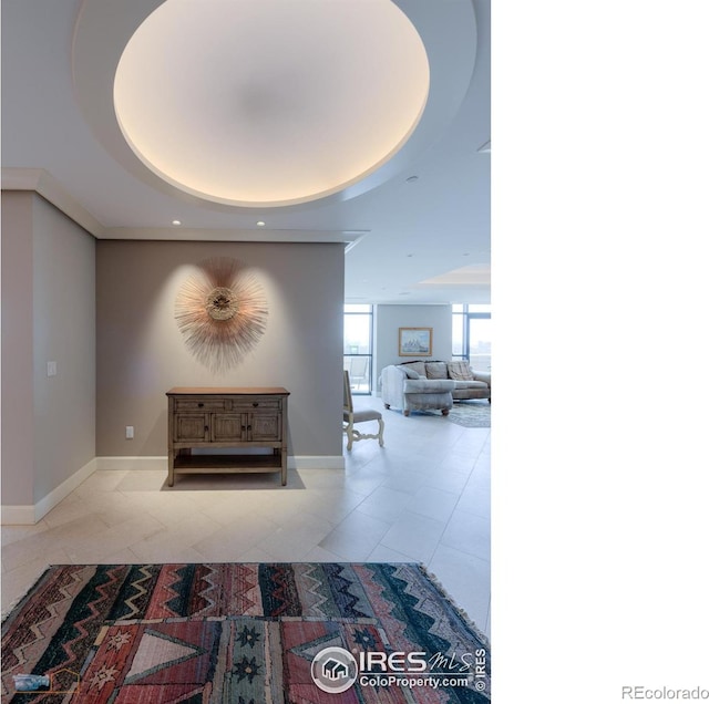 1077 Canyon Blvd # 403, Boulder, CO 80302 - corridor featuring a raised ceiling, tile patterned floors, baseboards, and recessed lighting