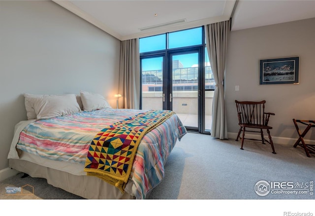 1077 Canyon Blvd # 403, Boulder, CO 80302 - carpeted bedroom with access to exterior, baseboards, and a wall of windows