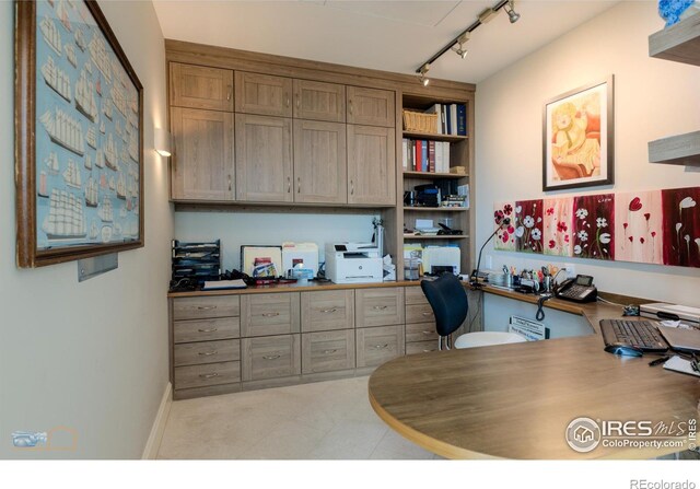 1077 Canyon Blvd # 403, Boulder, CO 80302 - home office with built in study area, rail lighting, and baseboards