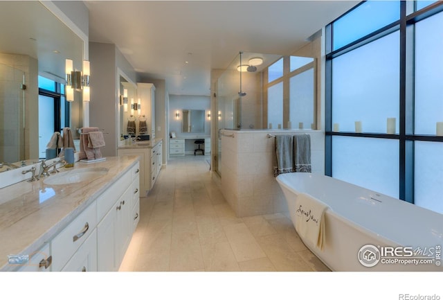 1077 Canyon Blvd # 403, Boulder, CO 80302 - bathroom with a tile shower, healthy amount of natural light, and a freestanding bath