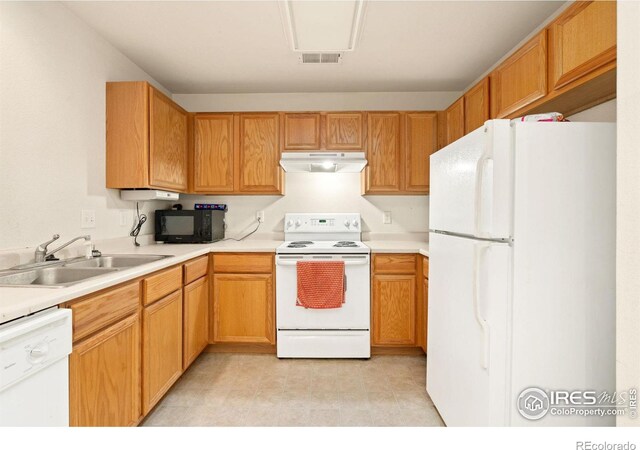 kitchen with white appliances and sink