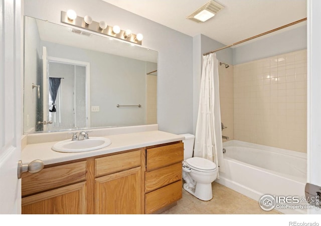 full bathroom with toilet, vanity, tile patterned floors, and shower / bath combo with shower curtain