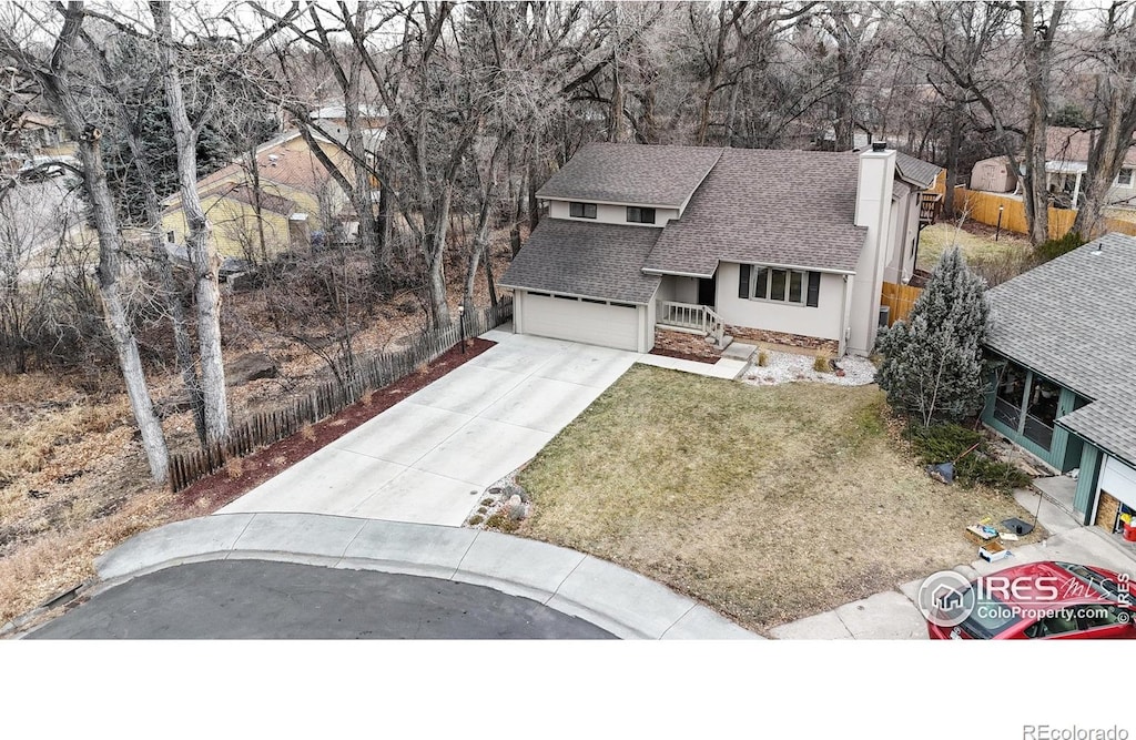 view of front of home featuring a garage and a front yard