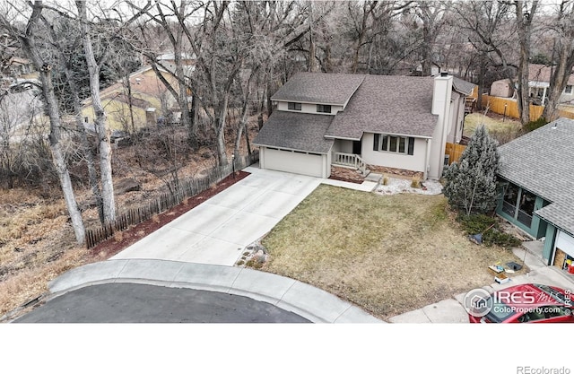 view of front of home featuring a garage and a front yard