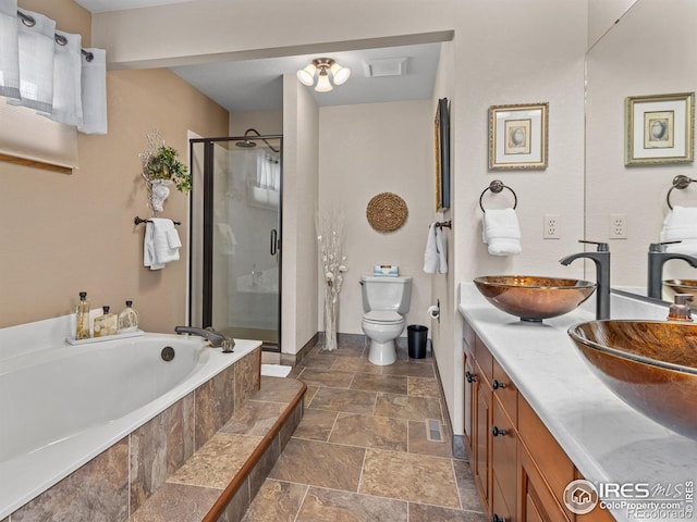 full bathroom with separate shower and tub, vanity, and toilet