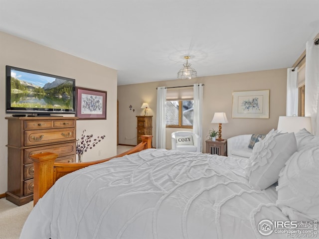 carpeted bedroom featuring multiple windows