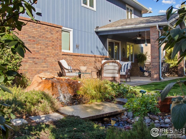 back of property featuring a patio area and ceiling fan