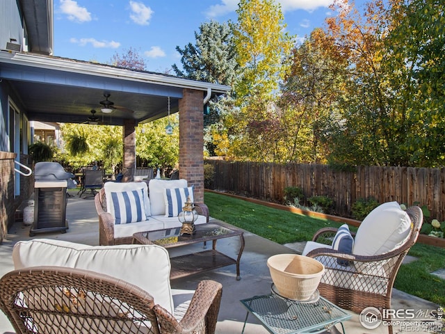 view of patio featuring an outdoor hangout area and ceiling fan