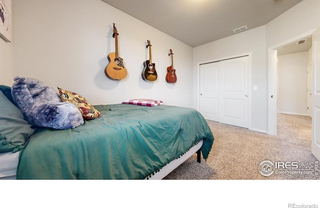 carpeted bedroom with a closet