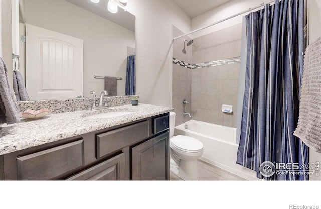 full bathroom featuring tile patterned flooring, vanity, toilet, and shower / bathtub combination with curtain