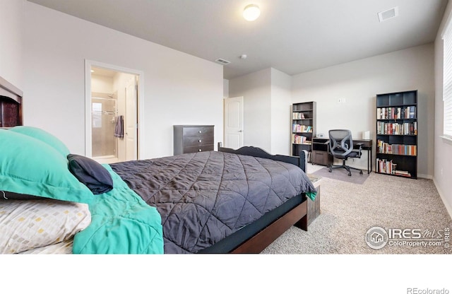 bedroom featuring light carpet and connected bathroom