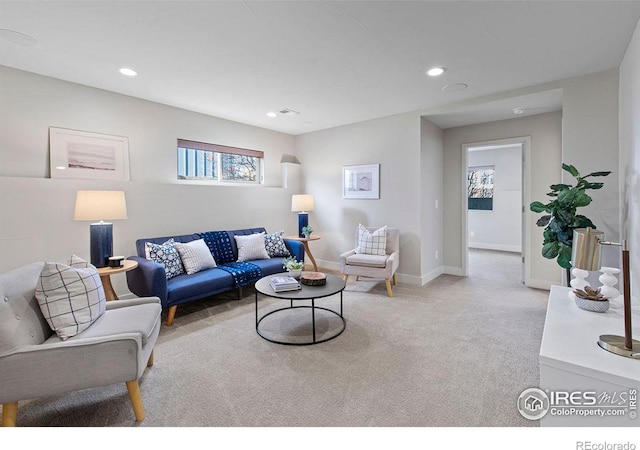 living room featuring light colored carpet