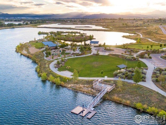 aerial view at dusk with a water view