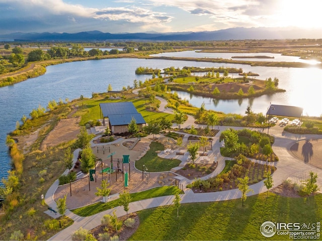 bird's eye view with a water and mountain view