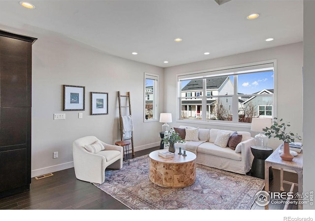 living room with dark hardwood / wood-style flooring