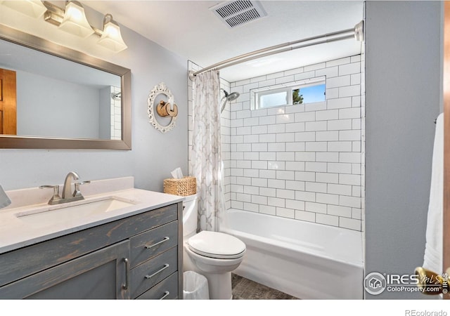 full bathroom with vanity, toilet, and shower / bath combo