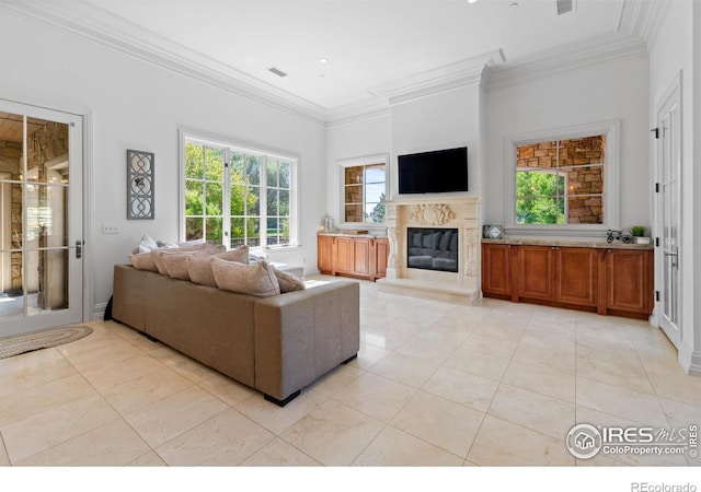 tiled living room featuring crown molding and a premium fireplace