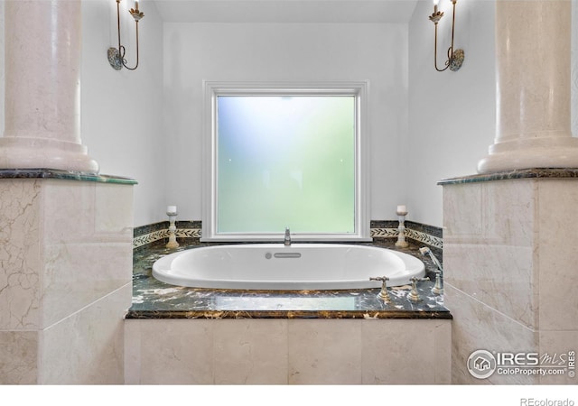 bathroom featuring a relaxing tiled tub