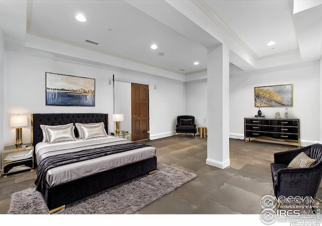 bedroom featuring a tray ceiling and ornamental molding