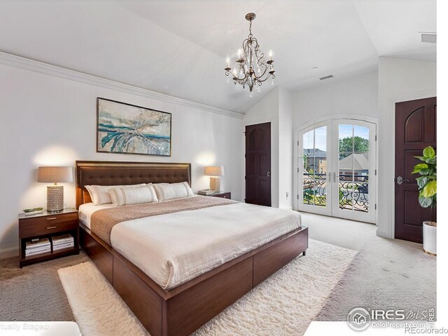 bedroom with light carpet, access to exterior, lofted ceiling, and an inviting chandelier