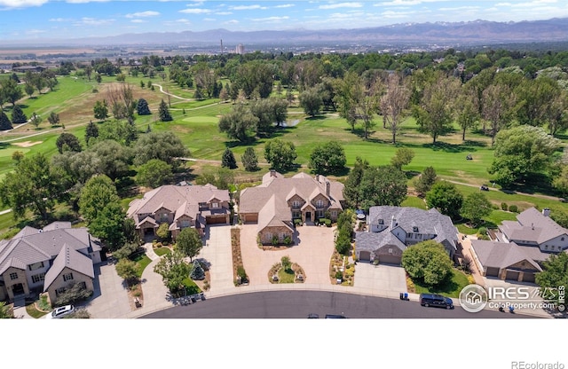 birds eye view of property with a mountain view