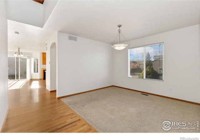 spare room featuring light hardwood / wood-style floors