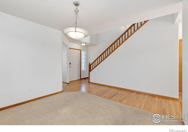 foyer entrance featuring hardwood / wood-style flooring