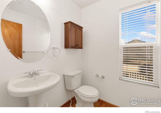 bathroom with toilet and sink