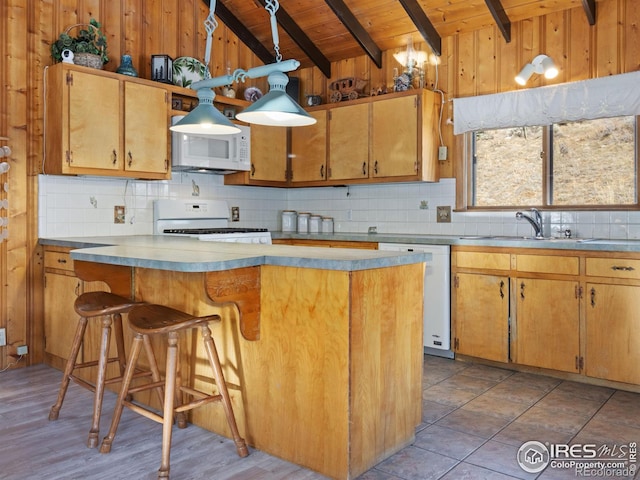 kitchen featuring white appliances, backsplash, wooden walls, and wooden ceiling