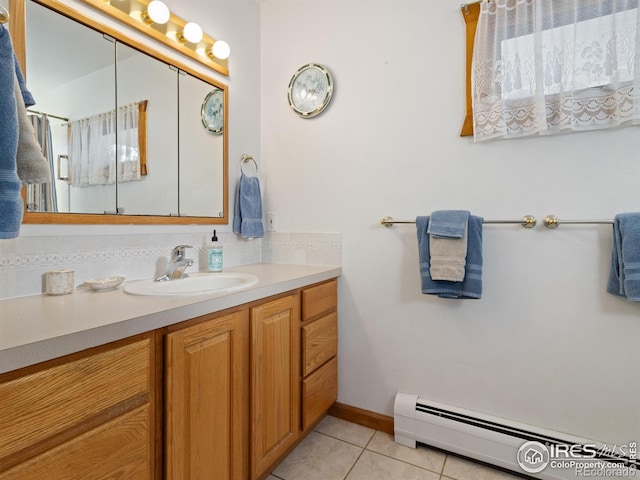 bathroom with tile patterned floors, vanity, and a baseboard radiator