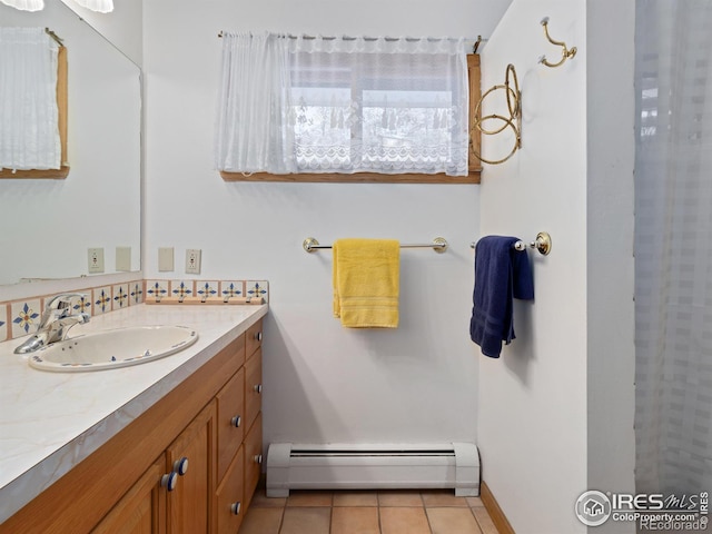 bathroom featuring tile patterned floors, vanity, and a baseboard radiator