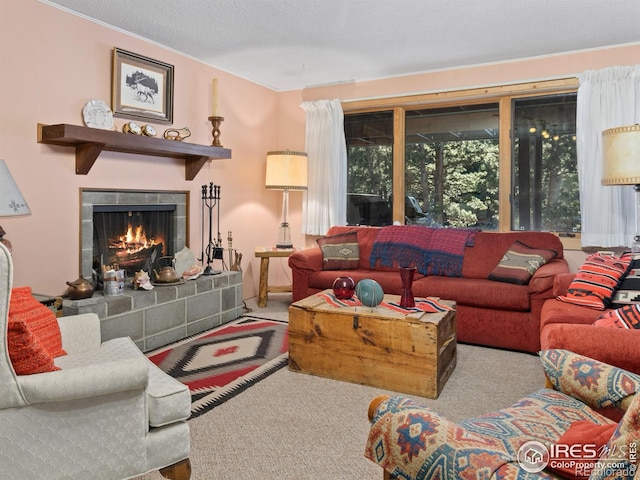 carpeted living room with a fireplace and a textured ceiling