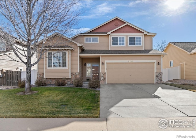 view of front of house featuring a garage and a front yard