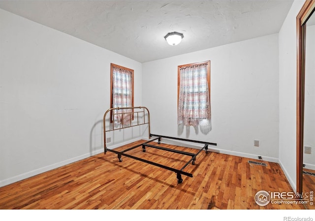 bedroom featuring hardwood / wood-style flooring