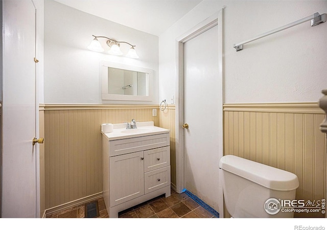 bathroom with vanity and toilet