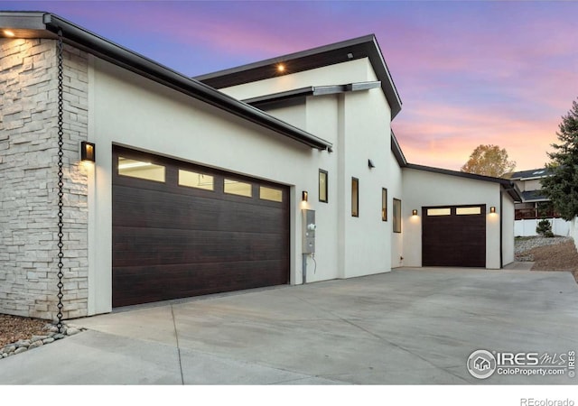 property exterior at dusk with a garage