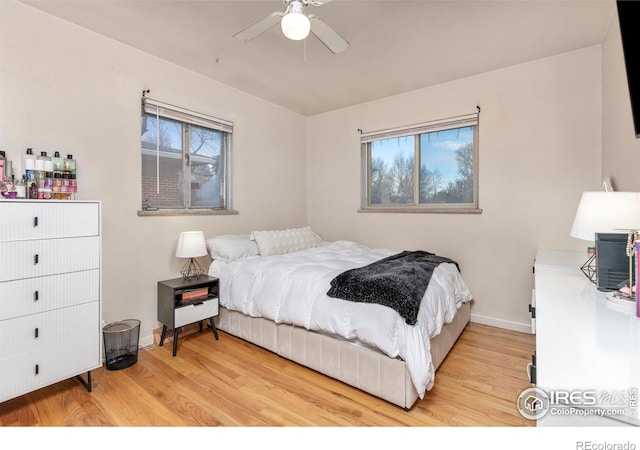 bedroom with ceiling fan and light hardwood / wood-style flooring