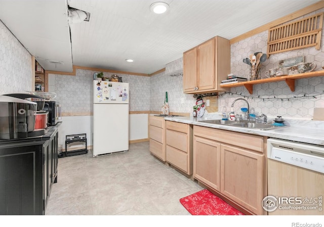 kitchen with white appliances, sink, ornamental molding, light brown cabinetry, and tasteful backsplash