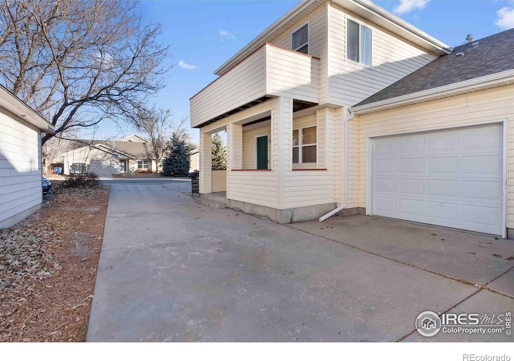 view of side of property with a garage