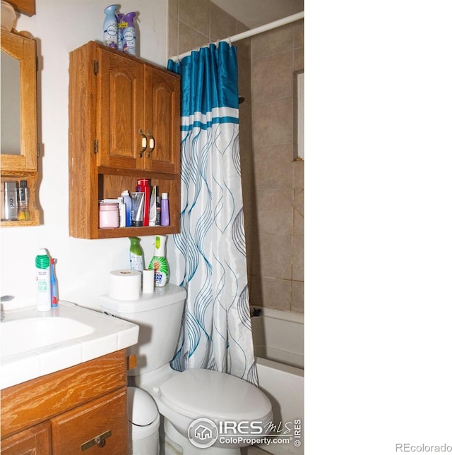 full bathroom featuring vanity, toilet, and shower / tub combo