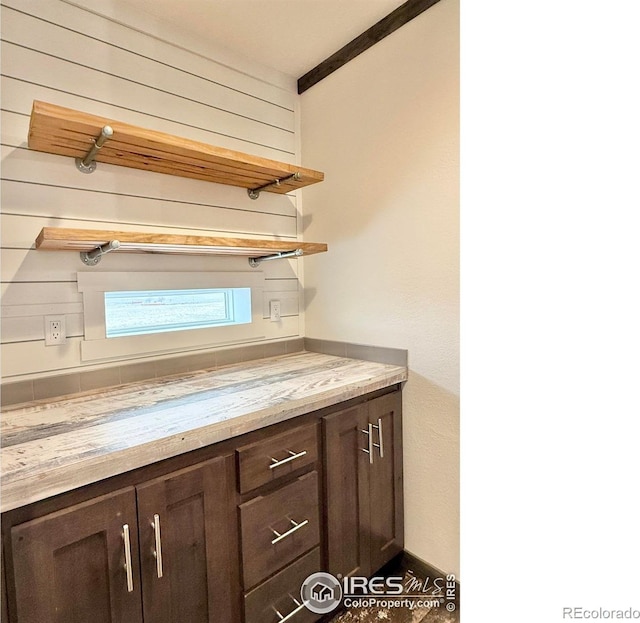 kitchen featuring dark brown cabinets