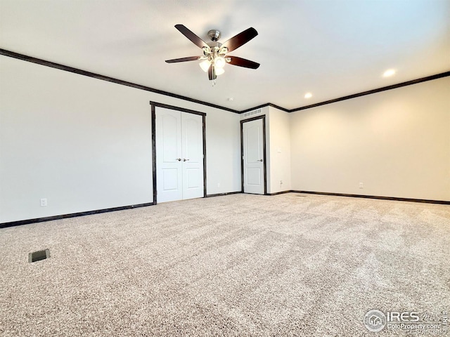 unfurnished bedroom with carpet floors, ceiling fan, and ornamental molding