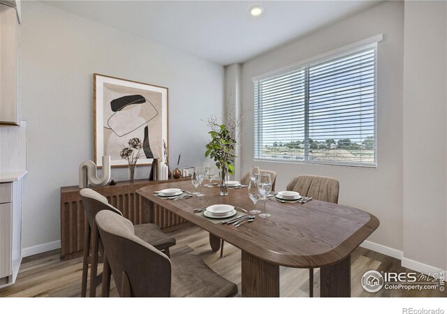 dining area featuring light wood-type flooring